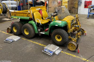 image showing a large yellow on-track machine