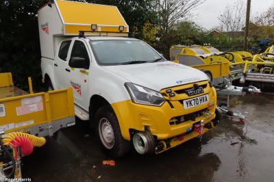 image showing a large yellow on-track machine