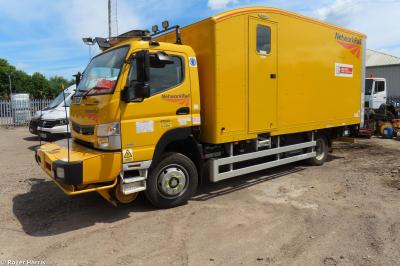 image showing a large yellow on-track machine