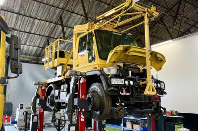 image showing a large yellow on-track machine
