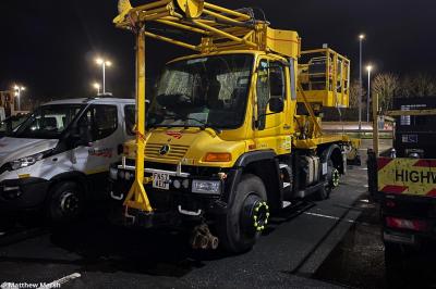 image showing a large yellow on-track machine