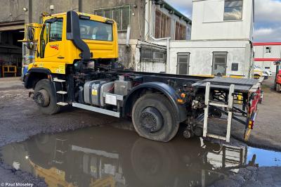image showing a large yellow on-track machine