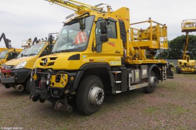 image showing a large yellow on-track machine