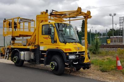 image showing a large yellow on-track machine