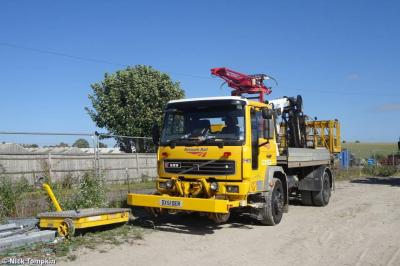 image showing a large yellow on-track machine