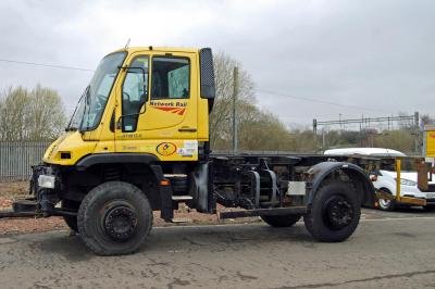 image showing a large yellow on-track machine