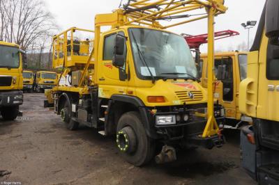 image showing a large yellow on-track machine