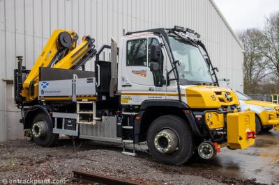 image showing a large yellow on-track machine