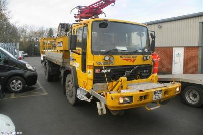image showing a large yellow on-track machine