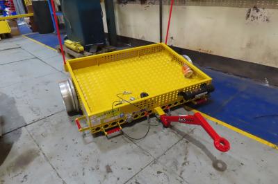 image showing a large yellow on-track machine