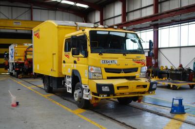 image showing a large yellow on-track machine