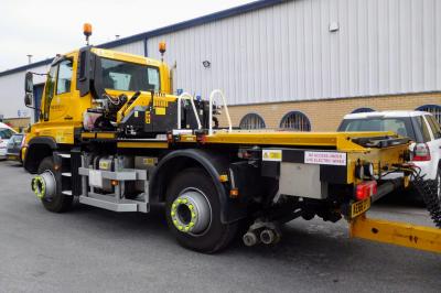 image showing a large yellow on-track machine