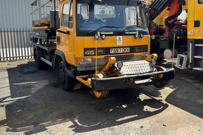 image showing a large yellow on-track machine