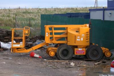 image showing a large yellow on-track machine