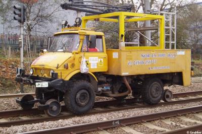 image showing a large yellow on-track machine