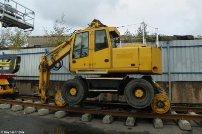 image showing a large yellow on-track machine