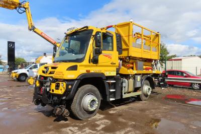 image showing a large yellow on-track machine