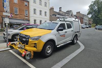 image showing a large yellow on-track machine