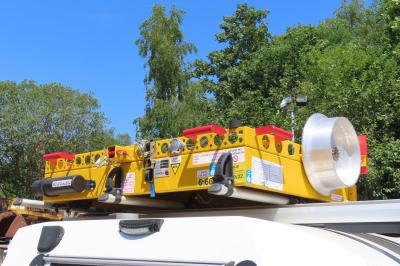 image showing a large yellow on-track machine