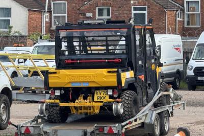 image showing a large yellow on-track machine