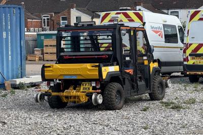 image showing a large yellow on-track machine