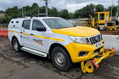 image showing a large yellow on-track machine
