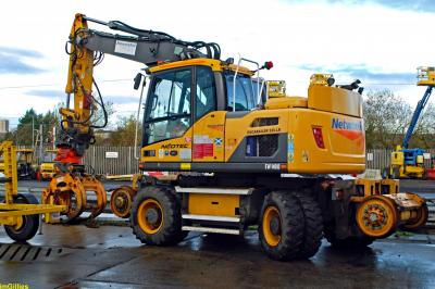 image showing a large yellow on-track machine