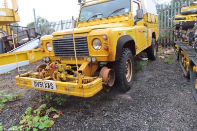 image showing a large yellow on-track machine