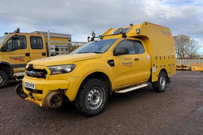 image showing a large yellow on-track machine
