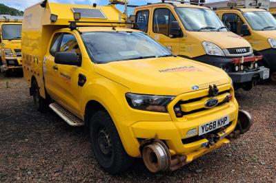 image showing a large yellow on-track machine