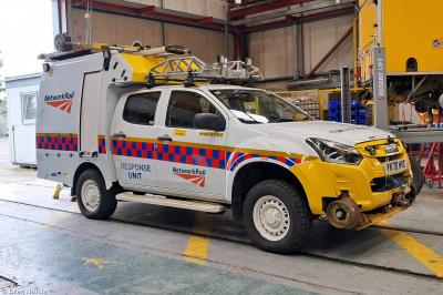 image showing a large yellow on-track machine