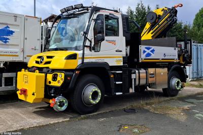 image showing a large yellow on-track machine