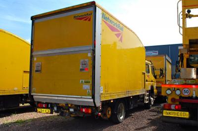 image showing a large yellow on-track machine