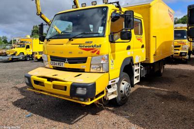 image showing a large yellow on-track machine