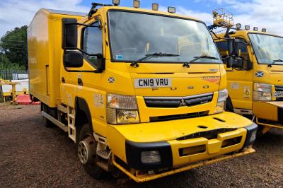 image showing a large yellow on-track machine