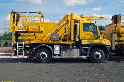 image showing a large yellow on-track machine