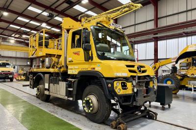 image showing a large yellow on-track machine