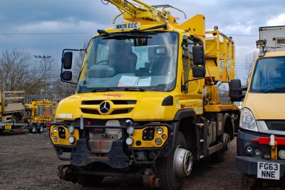 image showing a large yellow on-track machine