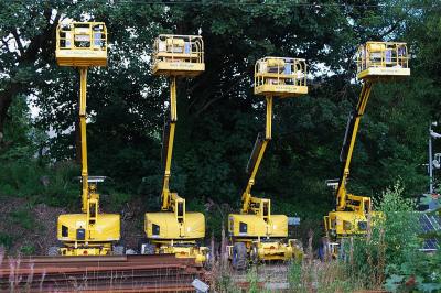 image showing a large yellow on-track machine