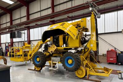 image showing a large yellow on-track machine