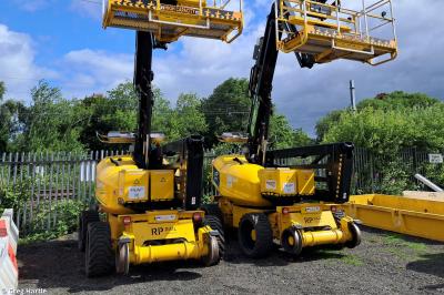image showing a large yellow on-track machine