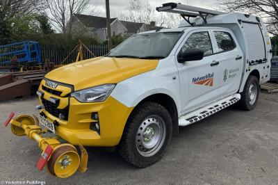 image showing a large yellow on-track machine