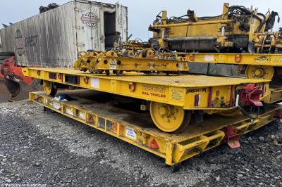 image showing a large yellow on-track machine