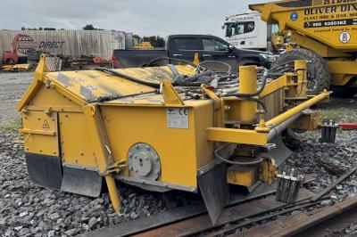 image showing a large yellow on-track machine