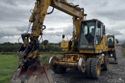 image showing a large yellow on-track machine