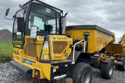 image showing a large yellow on-track machine