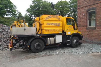 image showing a large yellow on-track machine