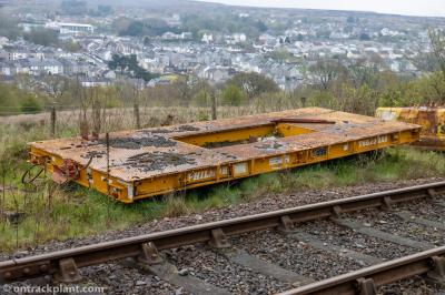 image showing a large yellow on-track machine