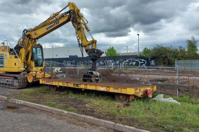 image showing a large yellow on-track machine