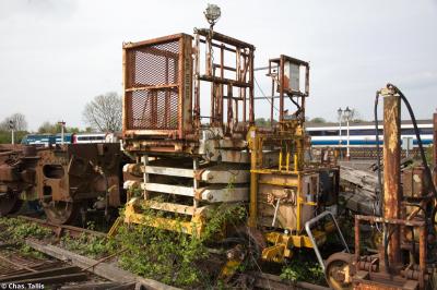 image showing a large yellow on-track machine